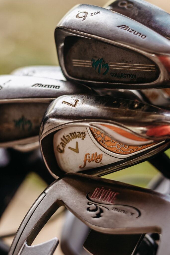 Detailed image showcasing different golf club heads, highlighting brands and designs.
